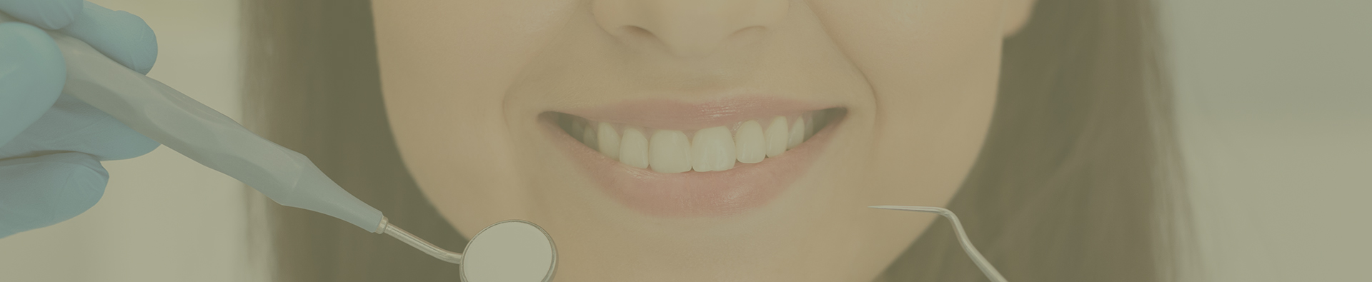 Close up of smiling young woman attenting dental clinic, hands of dentist with tools
